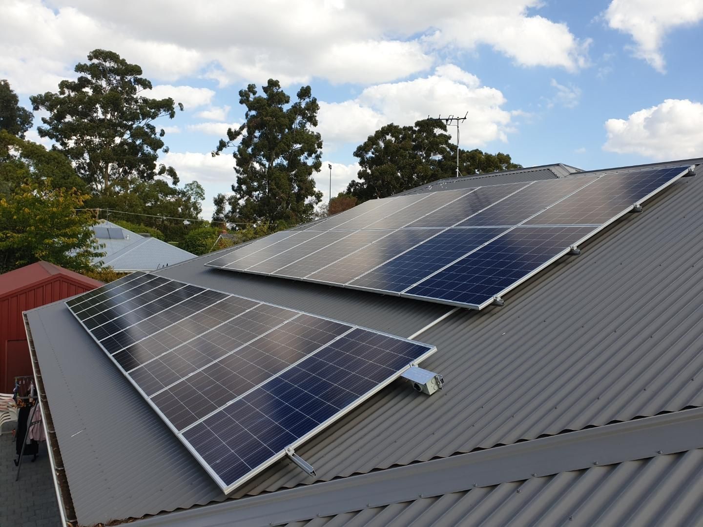 A roof with a lot of solar panels on it