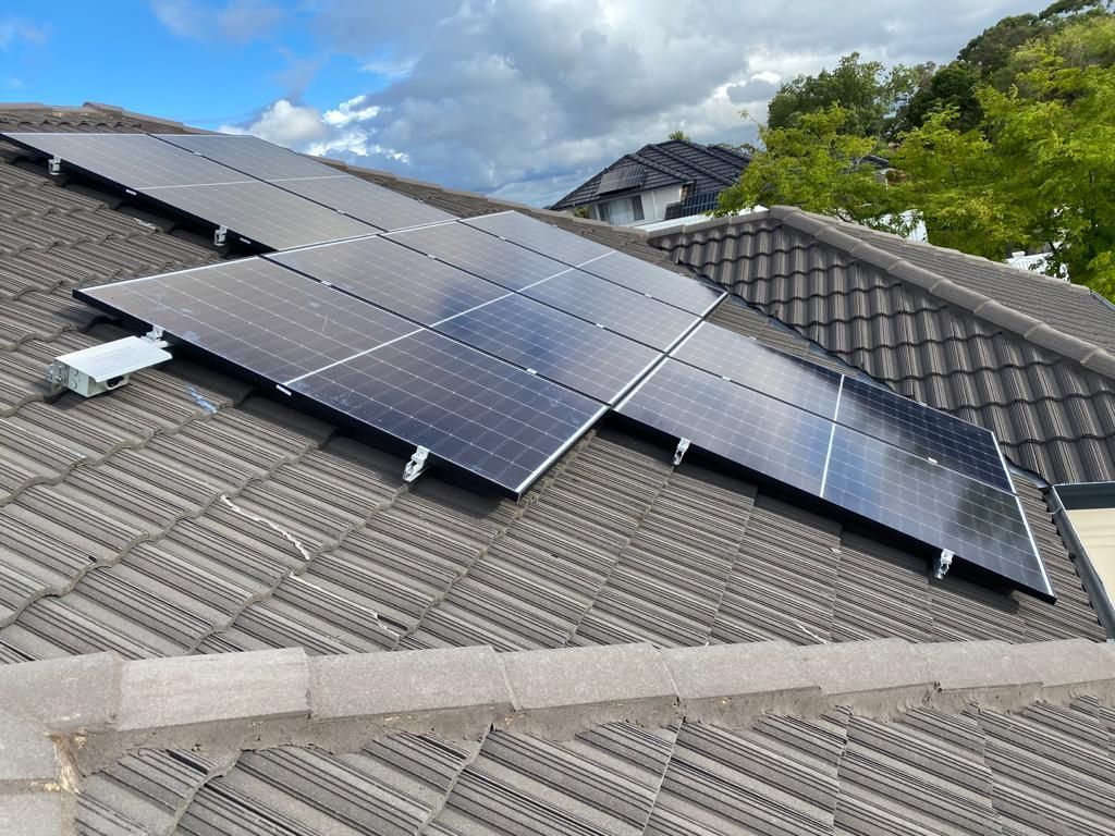 A roof with a lot of solar panels on it